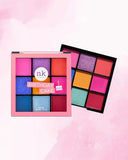 Nicka K Nine Color Eyeshadow Palette with vibrant birthday cake-inspired shades, featuring a variety of colorful eyeshadow pans.