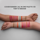 Two arms with swatches of Cover Ranger makeup palette on a neutral background